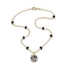 Collier Kalahari chaîne dorée perles émaillées noires et pendentif en jaspe dalmatien sur fond blanc - LELIEGE